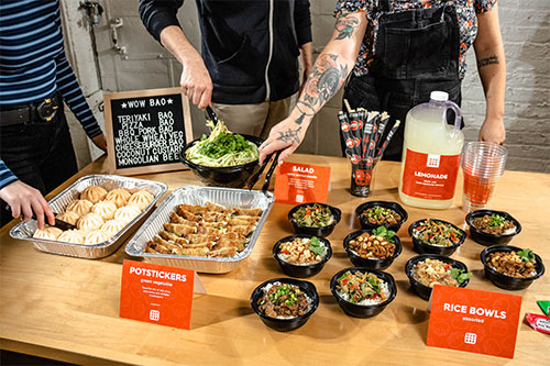 large party size trays of bao, potstickers and other food